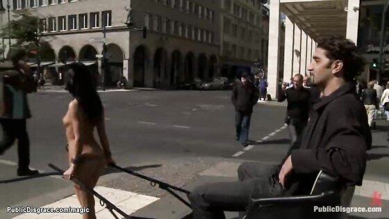 Naked slave drives chariot in public