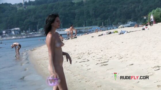 Bombastic young nudist babes sunbathe nude at the beach