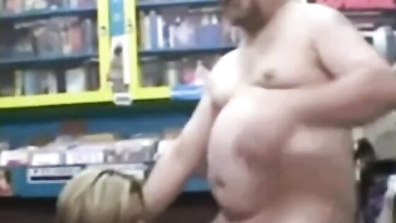 Woman randomly sucks a dirty video store clerk