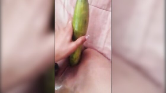 Coloured girl uses cucumber on tight pussy