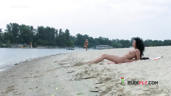 Ravishing nude beach girl caught on a hidden camera sunbathing outdoors