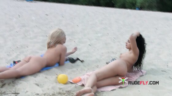 Ravishing nude beach girl caught on a hidden camera sunbathing outdoors