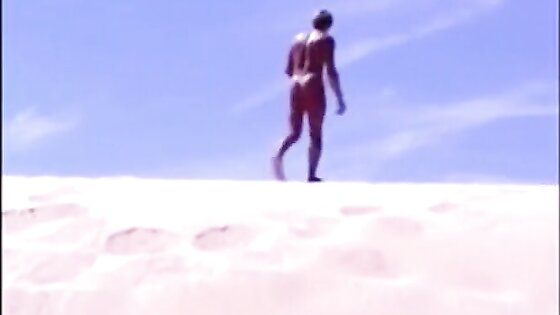 Tanned guy on beach in tiny string thong (temporarily!)