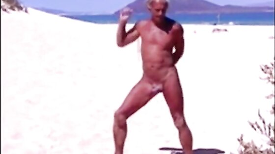 Tanned guy on beach in tiny string thong (temporarily!)