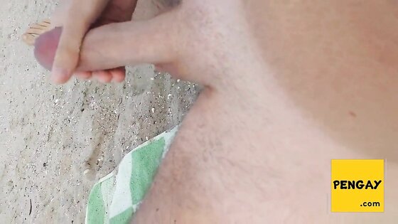 Gay wanks his huge dick and cums at the beach in public