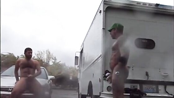 Public Rainy Stroking in a Parking Lot by Two Horny Men
