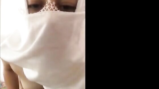 Slutty Muslim in Hijab fucking herself with a liquor bottle