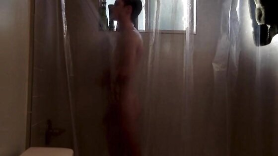 Twink takes shower while being recorded