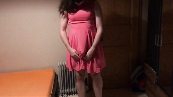 Sissy in pink dress strokes her cock with cumshot on face