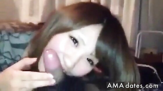 Asian girl giving a blowjob