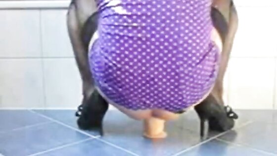 Crossdresser rides fat dildo