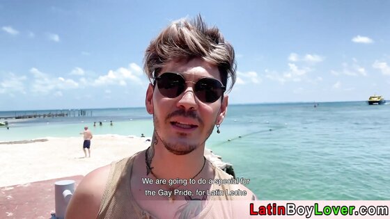 Latin guys celebrate gay pride on the beach outdoor